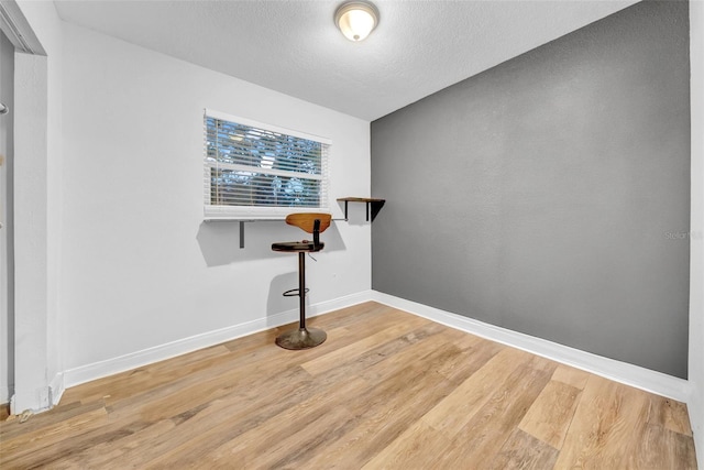 4726 W Fairview Hts, Tampa, FL 33616 - empty room featuring wood finished floors, baseboards, and a textured ceiling
