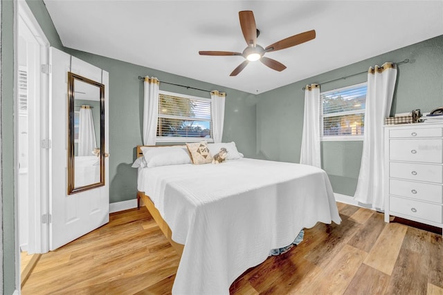 4726 W Fairview Hts, Tampa, FL 33616 - bedroom with light wood-style floors, a ceiling fan, and baseboards