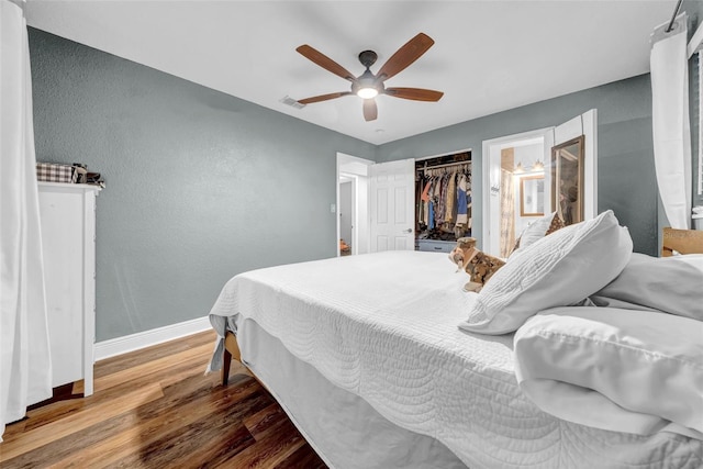 4726 W Fairview Hts, Tampa, FL 33616 - bedroom with wood finished floors, baseboards, a textured wall, ceiling fan, and a closet
