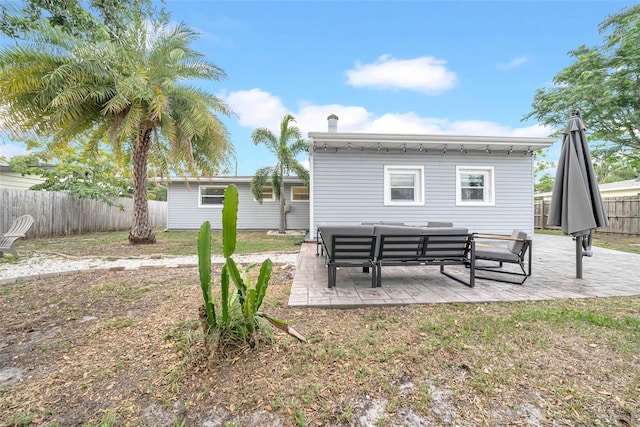 4726 W Fairview Hts, Tampa, FL 33616 - rear view of property featuring a patio area and an outdoor living space
