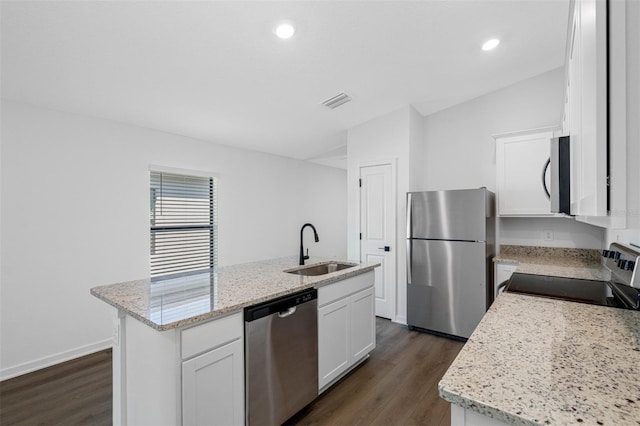 9471 Eldridge Rd, Spring Hill, FL 34608 - kitchen featuring appliances with stainless steel finishes, a sink, dark wood-type flooring, a center island with sink, and recessed lighting