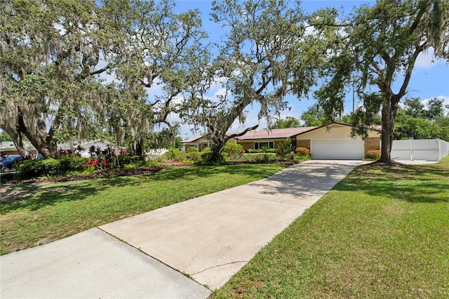 708 Westwood Cir, Brandon, FL 33511 - view of front of property featuring driveway and a garage
