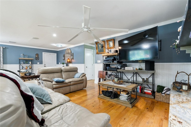 708 Westwood Cir, Brandon, FL 33511 - living area featuring a wainscoted wall, ornamental molding, ceiling fan, and wood finished floors