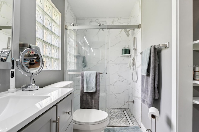 708 Westwood Cir, Brandon, FL 33511 - bathroom featuring toilet, vanity, and a marble finish shower