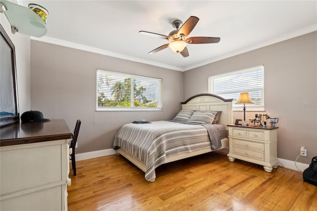 708 Westwood Cir, Brandon, FL 33511 - bedroom with light wood finished floors, crown molding, baseboards, and a ceiling fan