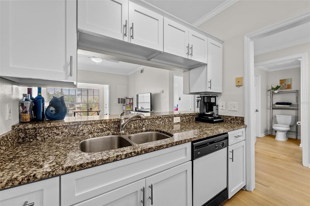 800 S Dakota Ave Unit 337, Tampa, FL 33606 - kitchen with dishwasher, a sink, ornamental molding, white cabinetry, and dark stone counters