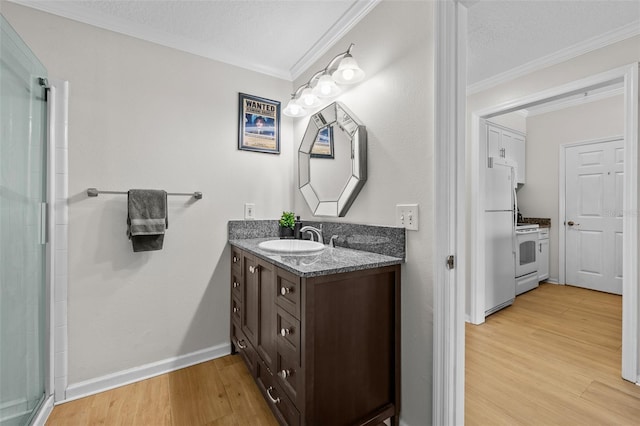 800 S Dakota Ave Unit 337, Tampa, FL 33606 - full bath featuring vanity, wood finished floors, crown molding, baseboards, and a shower with door