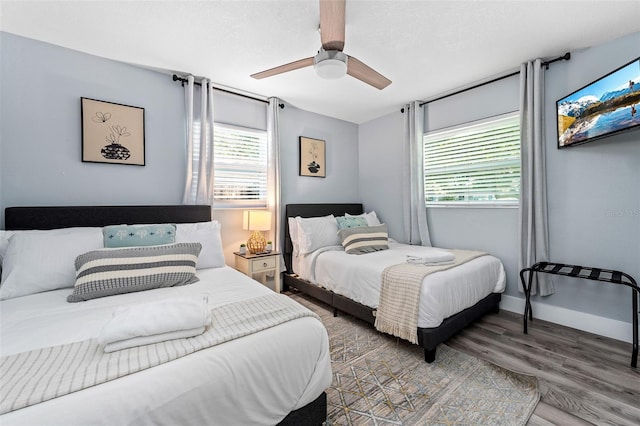 3485 Floral Dr, Largo, FL 33771 - bedroom featuring multiple windows, wood finished floors, and a ceiling fan