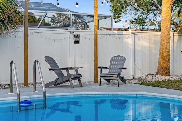 3485 Floral Dr, Largo, FL 33771 - swimming pool with glass enclosure and a patio area