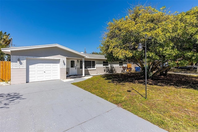3485 Floral Dr, Largo, FL 33771 - ranch-style house with an attached garage and concrete driveway