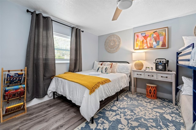3485 Floral Dr, Largo, FL 33771 - bedroom with a textured ceiling, ceiling fan, and wood finished floors