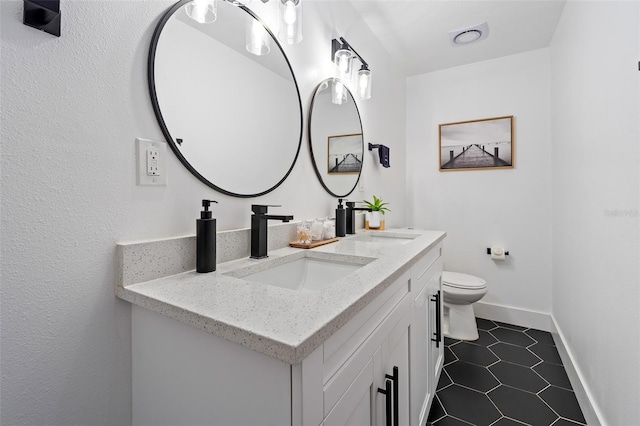 3485 Floral Dr, Largo, FL 33771 - bathroom featuring double vanity and tile patterned flooring