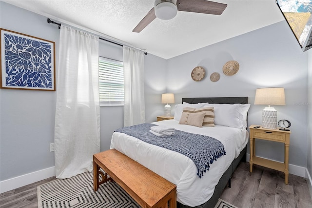 3485 Floral Dr, Largo, FL 33771 - bedroom featuring wood finished floors, a ceiling fan, and a textured ceiling