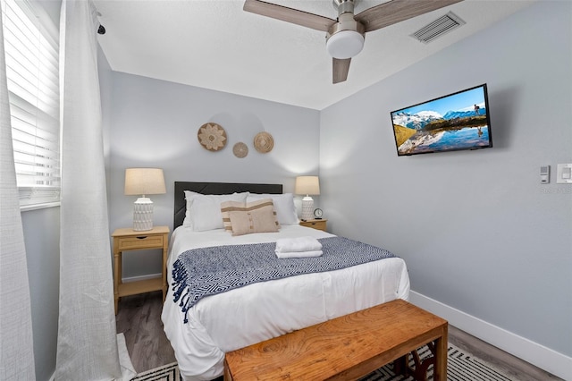 3485 Floral Dr, Largo, FL 33771 - bedroom with wood finished floors and a ceiling fan