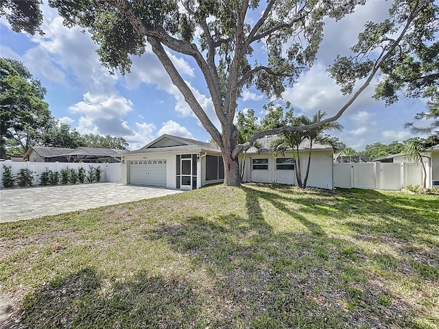 9580 130th Ave, Largo, FL 33773 - single story home with a garage, decorative driveway, and stucco siding