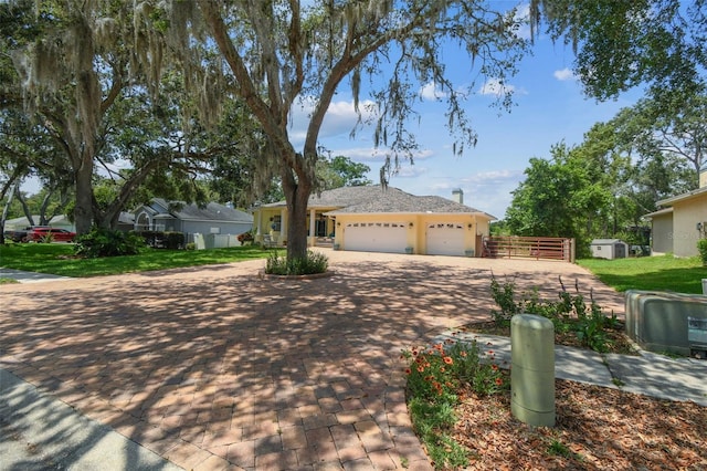 10306 Shalimar Wood Dr, Thonotosassa, FL 33592 - single story home featuring an attached garage and decorative driveway