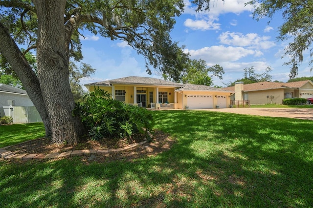 10306 Shalimar Wood Dr, Thonotosassa, FL 33592 - ranch-style home featuring a garage, a front lawn, concrete driveway, and stucco siding