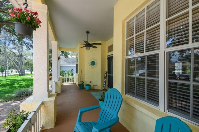 10306 Shalimar Wood Dr, Thonotosassa, FL 33592 - covered porch with a ceiling fan