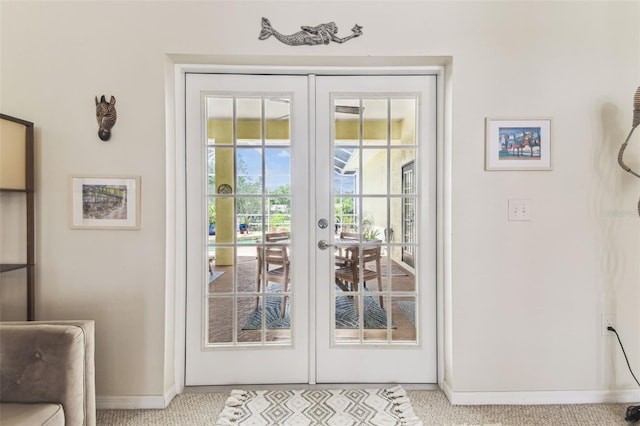 10306 Shalimar Wood Dr, Thonotosassa, FL 33592 - doorway featuring french doors and baseboards