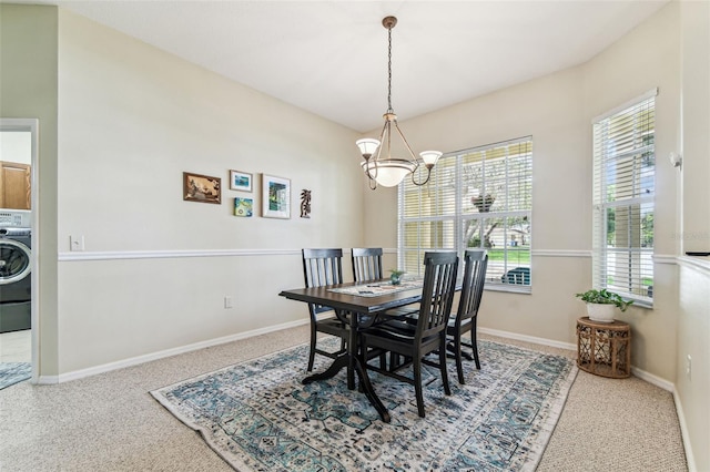 10306 Shalimar Wood Dr, Thonotosassa, FL 33592 - dining room featuring a chandelier, washer / clothes dryer, carpet, and baseboards