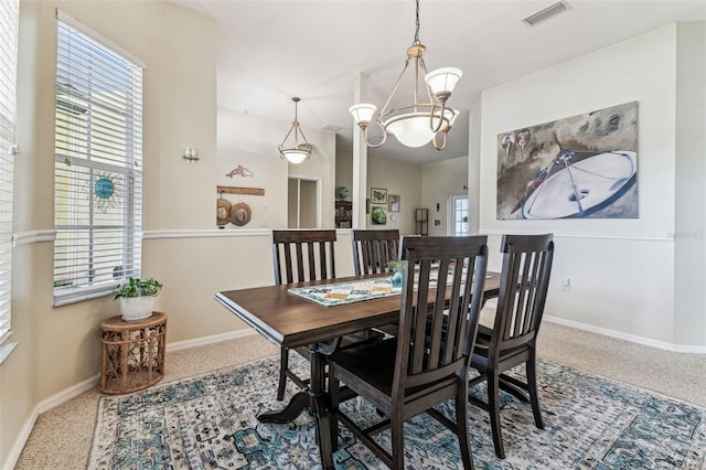 10306 Shalimar Wood Dr, Thonotosassa, FL 33592 - carpeted dining area with baseboards and a chandelier