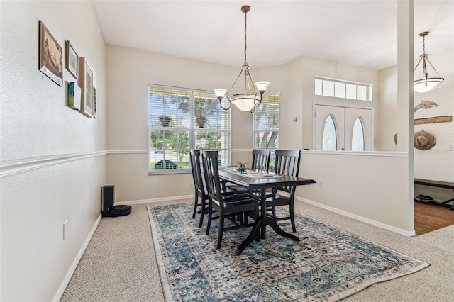 10306 Shalimar Wood Dr, Thonotosassa, FL 33592 - dining space with carpet floors, a chandelier, and baseboards