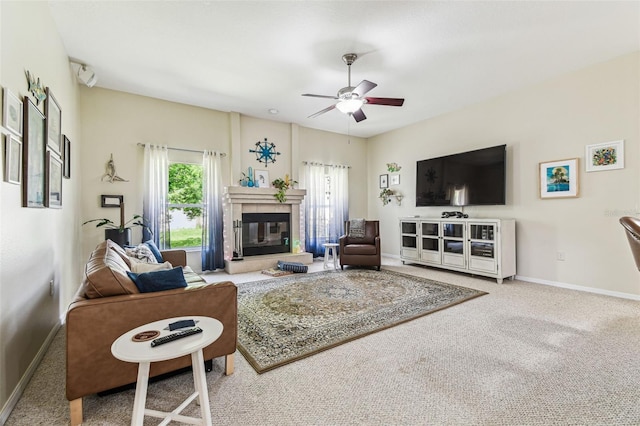 10306 Shalimar Wood Dr, Thonotosassa, FL 33592 - living area featuring a ceiling fan, baseboards, carpet, and a glass covered fireplace