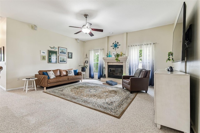 10306 Shalimar Wood Dr, Thonotosassa, FL 33592 - living area featuring a ceiling fan, carpet, a tiled fireplace, and baseboards