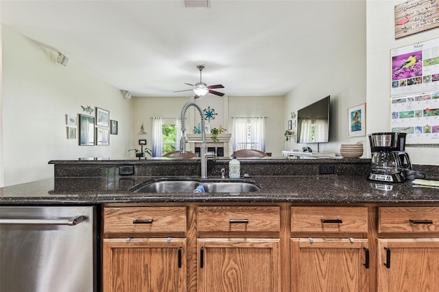10306 Shalimar Wood Dr, Thonotosassa, FL 33592 - kitchen with dishwasher, a sink, open floor plan, and brown cabinets