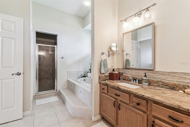10306 Shalimar Wood Dr, Thonotosassa, FL 33592 - full bath featuring vanity, a garden tub, tile patterned floors, and a stall shower