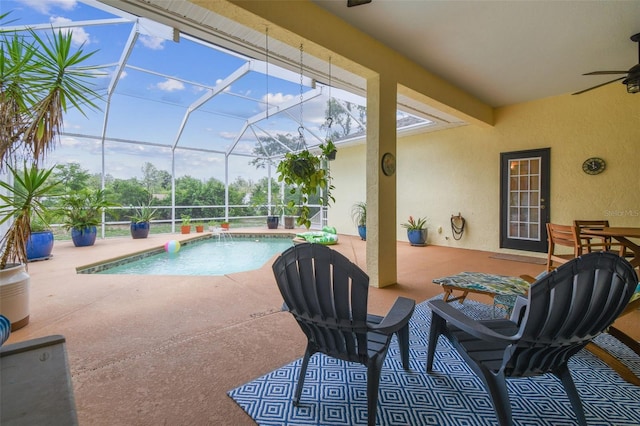 10306 Shalimar Wood Dr, Thonotosassa, FL 33592 - outdoor pool featuring a ceiling fan, a patio, and glass enclosure