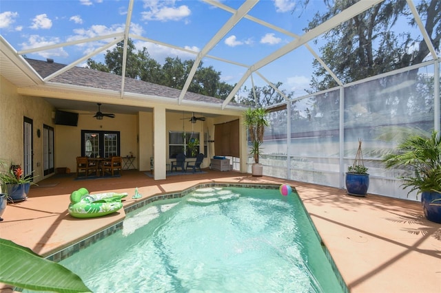 10306 Shalimar Wood Dr, Thonotosassa, FL 33592 - swimming pool featuring ceiling fan, a patio, outdoor dining space, a lanai, and french doors