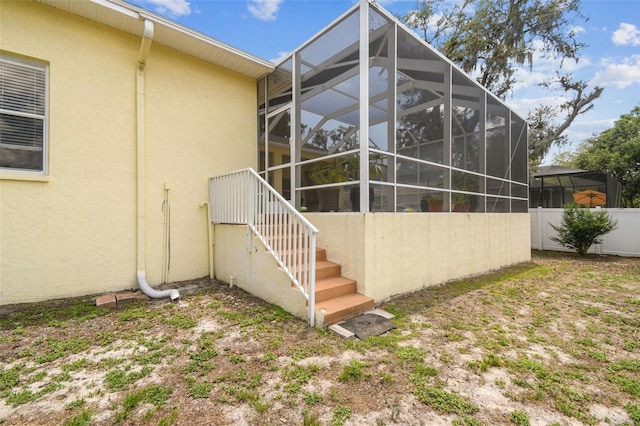 10306 Shalimar Wood Dr, Thonotosassa, FL 33592 - rear view of house featuring stucco siding, a lanai, and stairs