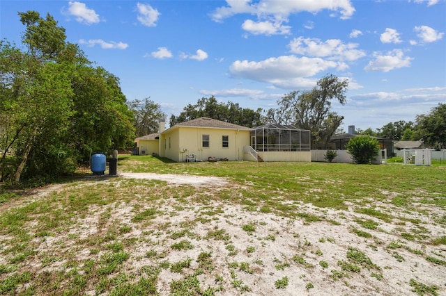10306 Shalimar Wood Dr, Thonotosassa, FL 33592 - view of green lawn featuring a lanai