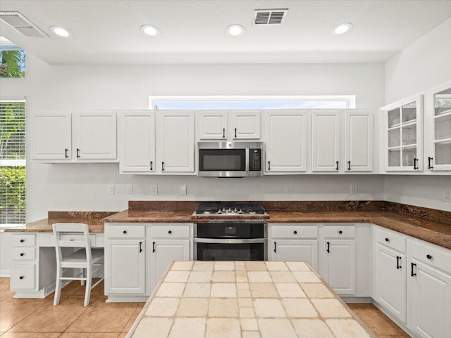 6127 Cezanne Ave, Lutz, FL 33558 - kitchen with appliances with stainless steel finishes, white cabinetry, and recessed lighting