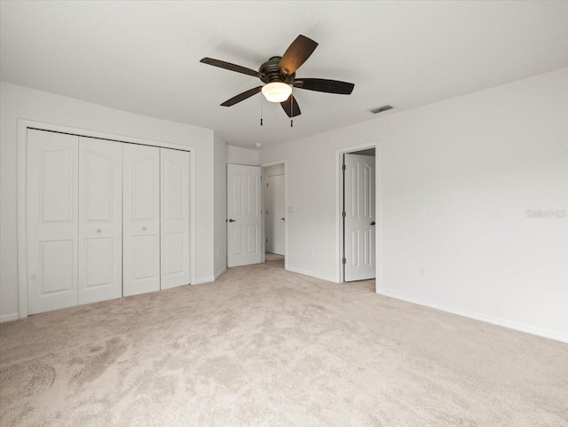 6127 Cezanne Ave, Lutz, FL 33558 - unfurnished bedroom with light colored carpet, baseboards, a closet, and ceiling fan