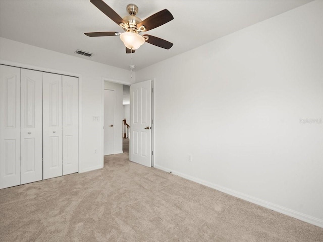 6127 Cezanne Ave, Lutz, FL 33558 - unfurnished bedroom featuring light colored carpet, baseboards, a closet, and ceiling fan