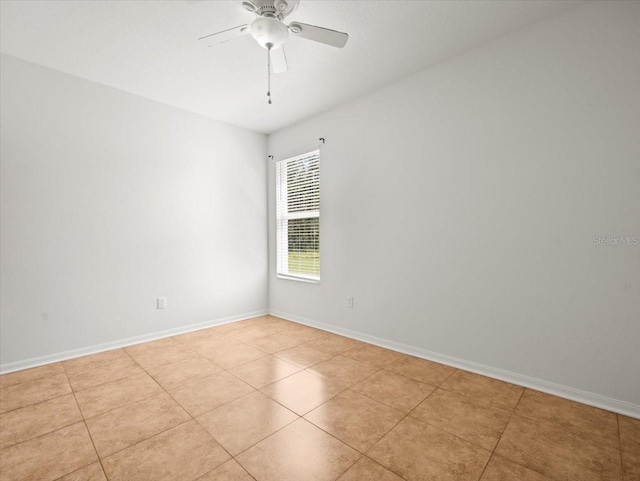 6127 Cezanne Ave, Lutz, FL 33558 - empty room with ceiling fan, light tile patterned floors, and baseboards