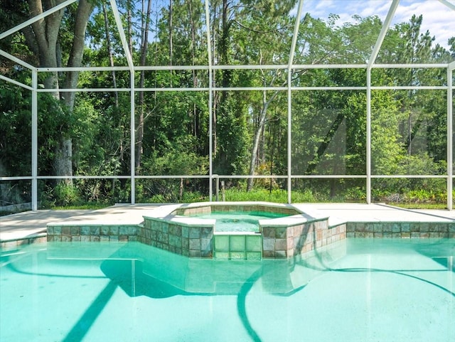 6127 Cezanne Ave, Lutz, FL 33558 - view of swimming pool with glass enclosure and a pool with connected hot tub