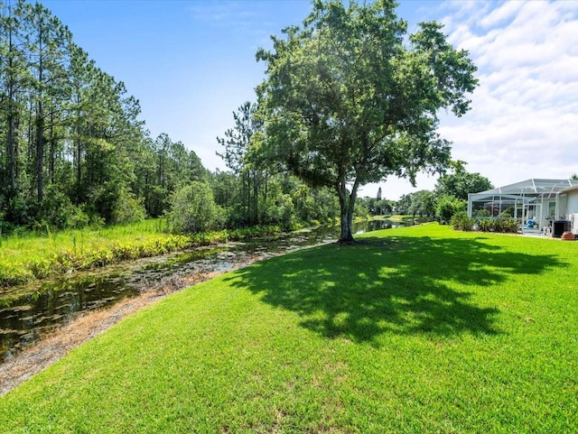 6127 Cezanne Ave, Lutz, FL 33558 - view of grassy yard featuring a water view
