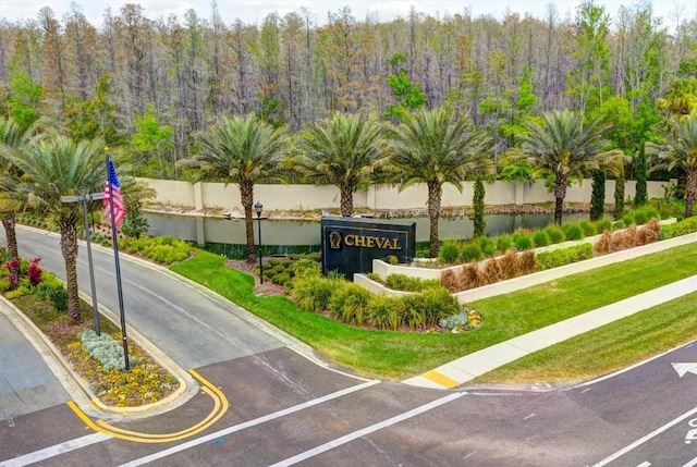 6127 Cezanne Ave, Lutz, FL 33558 - community sign with a lawn and a view of trees