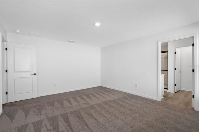 11199 Murraysville Dr, Spring Hill, FL 34609 - carpeted empty room featuring baseboards and recessed lighting