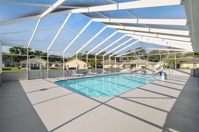 37420 Teaberry Loop, Zephyrhills, FL 33542 - view of pool featuring a patio, a lanai, and a residential view