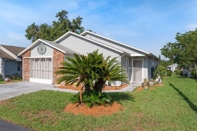 37420 Teaberry Loop, Zephyrhills, FL 33542 - view of front of property featuring a front lawn and brick siding