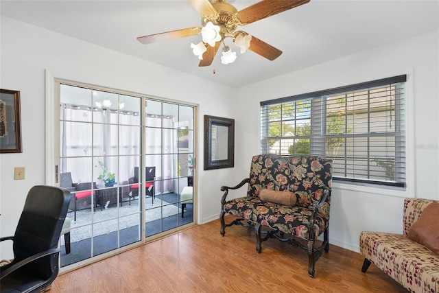 37420 Teaberry Loop, Zephyrhills, FL 33542 - living area with wood finished floors, baseboards, and a ceiling fan