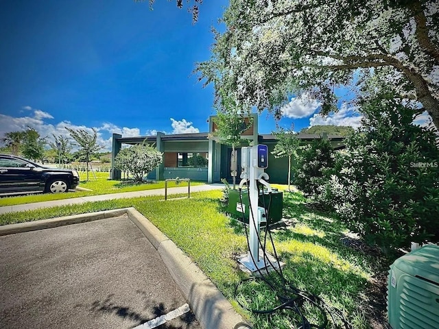 3428 Tranquil Trl, Kissimmee, FL 34747 - view of front of house featuring a front yard