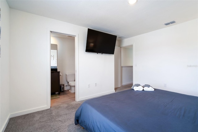 3428 Tranquil Trl, Kissimmee, FL 34747 - carpeted bedroom with baseboards and ensuite bathroom