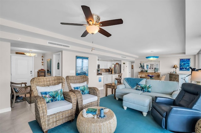 223 Island Way Unit 7F, Clearwater Beach, FL 33767 - living area with a ceiling fan and baseboards
