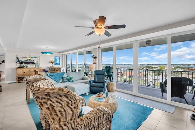 223 Island Way Unit 7F, Clearwater Beach, FL 33767 - living area with a ceiling fan, light tile patterned floors, and baseboards