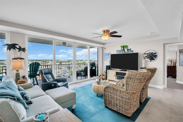 223 Island Way Unit 7F, Clearwater Beach, FL 33767 - tiled living room featuring a ceiling fan and baseboards
